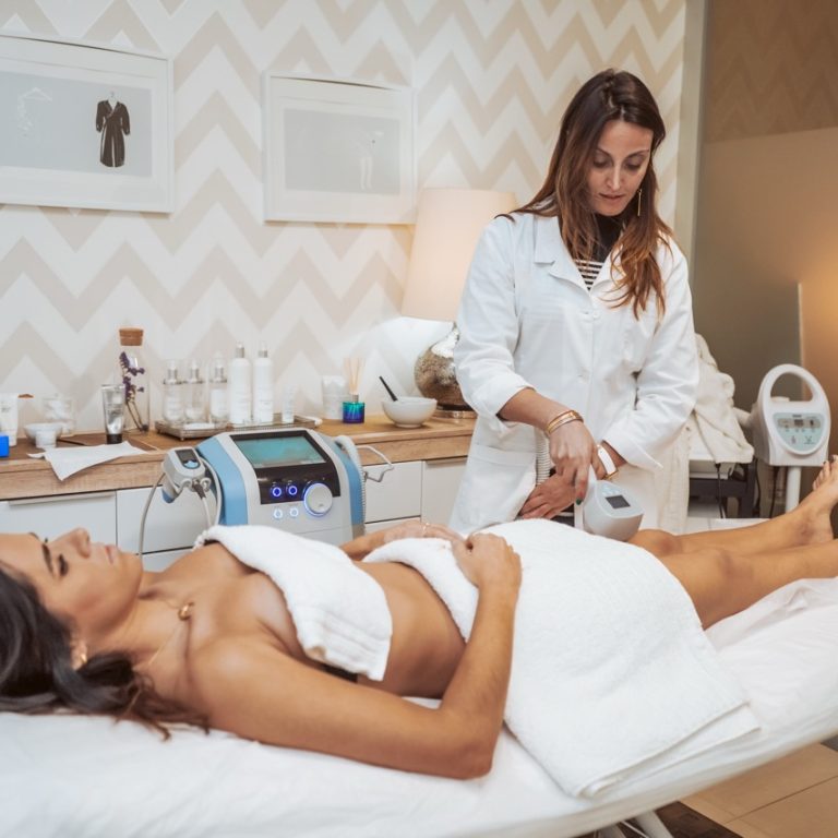 Woman getting cosmetic procedures at beauty center