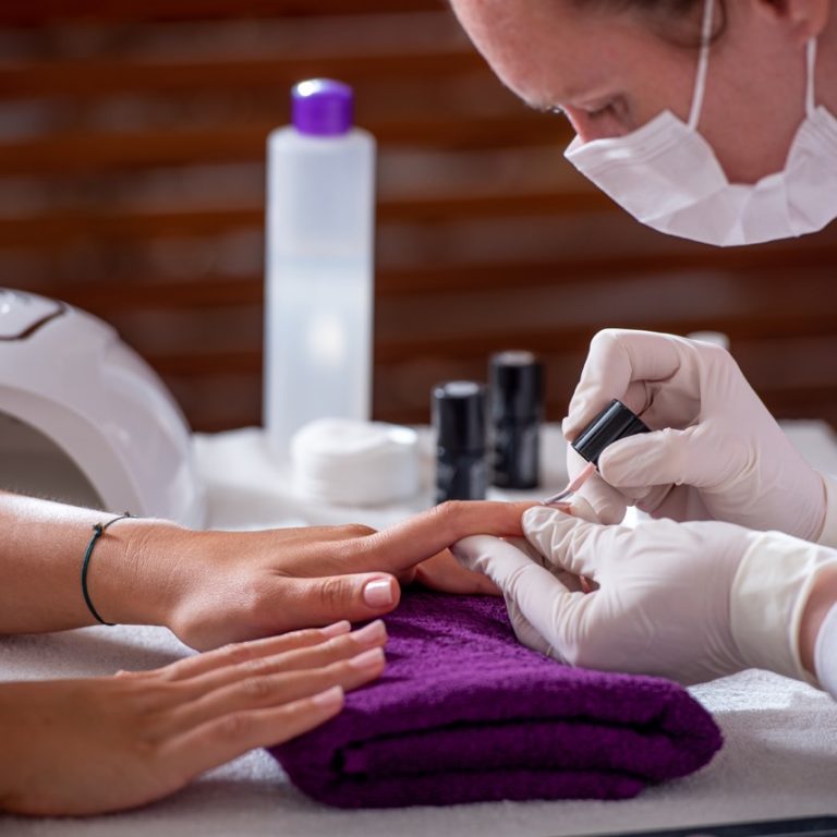 Cropped shot of a woman getting a manicure in the beauty salon